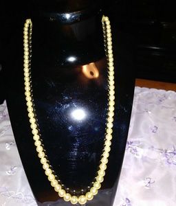Faux white pearl necklace with fish clamp